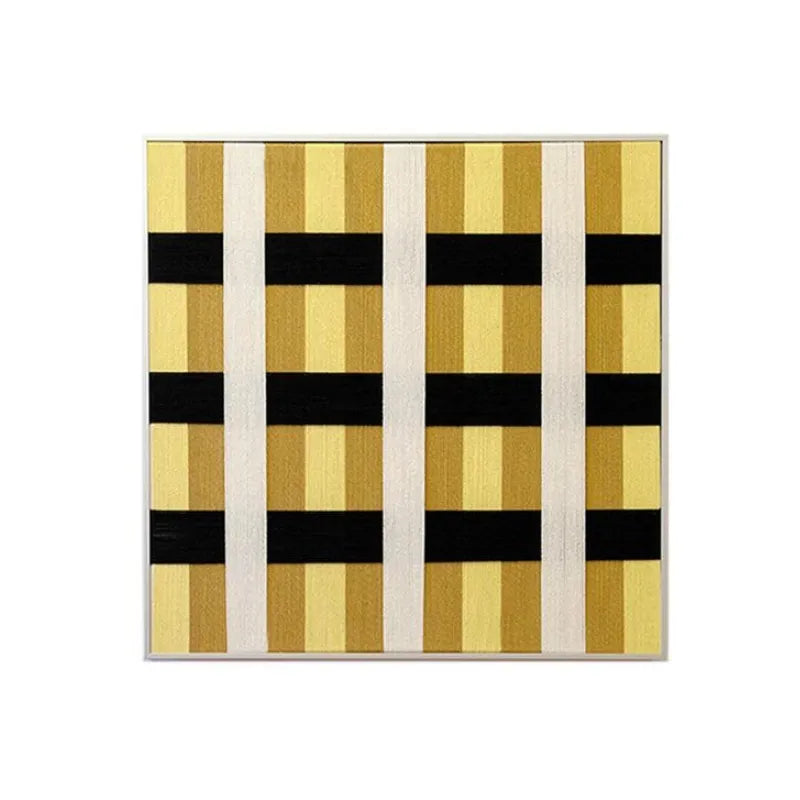 Front view of Downton Manor framed fiber wall art with mustard gold, black and white geometric grid on a white background