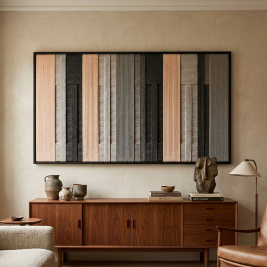 Ivory Structure black-framed fiber wall art displayed above a wooden credenza in a warm modern living room