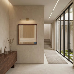 Framed wool wall art displayed in a modern architectural hallway with high ceilings and natural light.