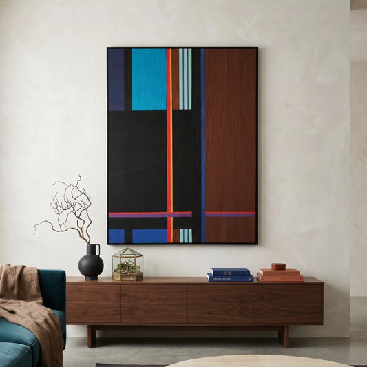 Large vertical hand-woven wool wall art with deep blue, black, and mahogany brown geometric panels hanging above a modern walnut sideboard in a contemporary living room.