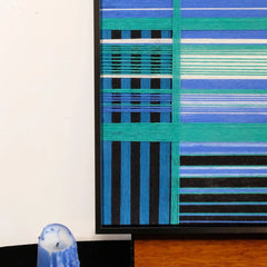 Close-up of Blues Harmony yarn art revealing tight looped wool texture and crisp transitions between navy and sky blue stripes