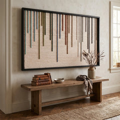 Striking Chromatic Rain hand-woven wool tapestry positioned perfectly above a long rustic wooden bench in a brightly lit, welcoming entryway.