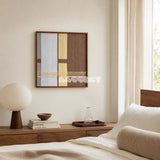 Diluted Solitude gray yellow and brown textile wall art styled above a low wood dresser in a bright neutral bedroom.