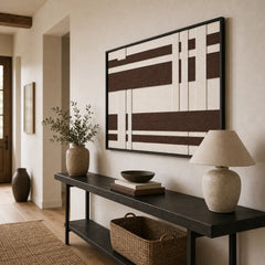 Striking Earthen Bands framed wall art styled in a bright entryway hallway, hanging elegantly above a sleek black console table.