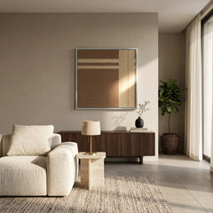 Large-scale textured wool wall decor centered in a contemporary lounge area with a cream sofa and minimalist wooden furniture.