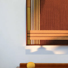 Front view of Earthy Fragrance wall art on a clean wall, highlighting its square format and warm earth-tone stripe design