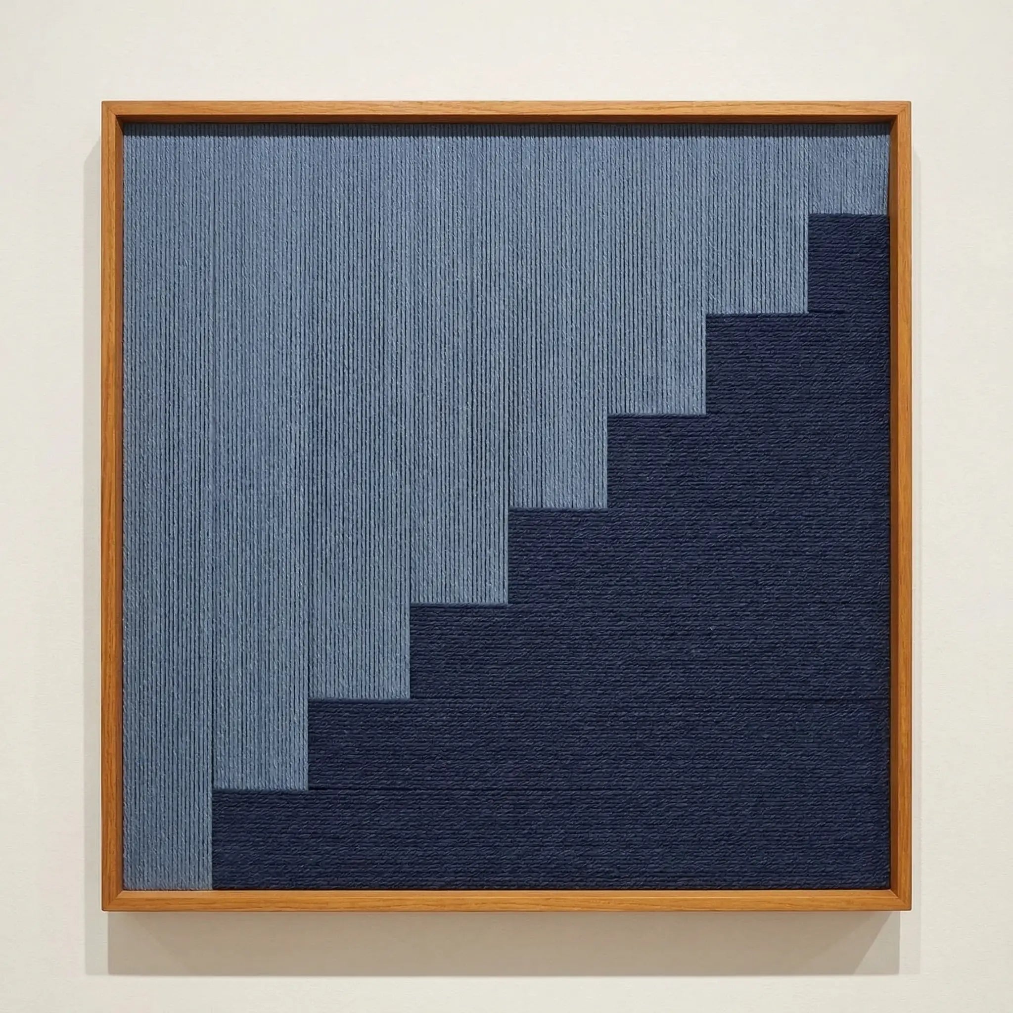 Direct front view of The Eighth Level hand-woven wool tapestry in a wooden frame, showcasing the tiered geometric weave and fiber texture.