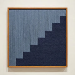 Direct front view of The Eighth Level hand-woven wool tapestry in a wooden frame, showcasing the tiered geometric weave and fiber texture.
