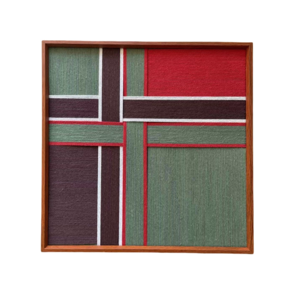 Studio product shot of the square framed fiber art, clearly showing the intersecting white lines and bold color block design on a white background.