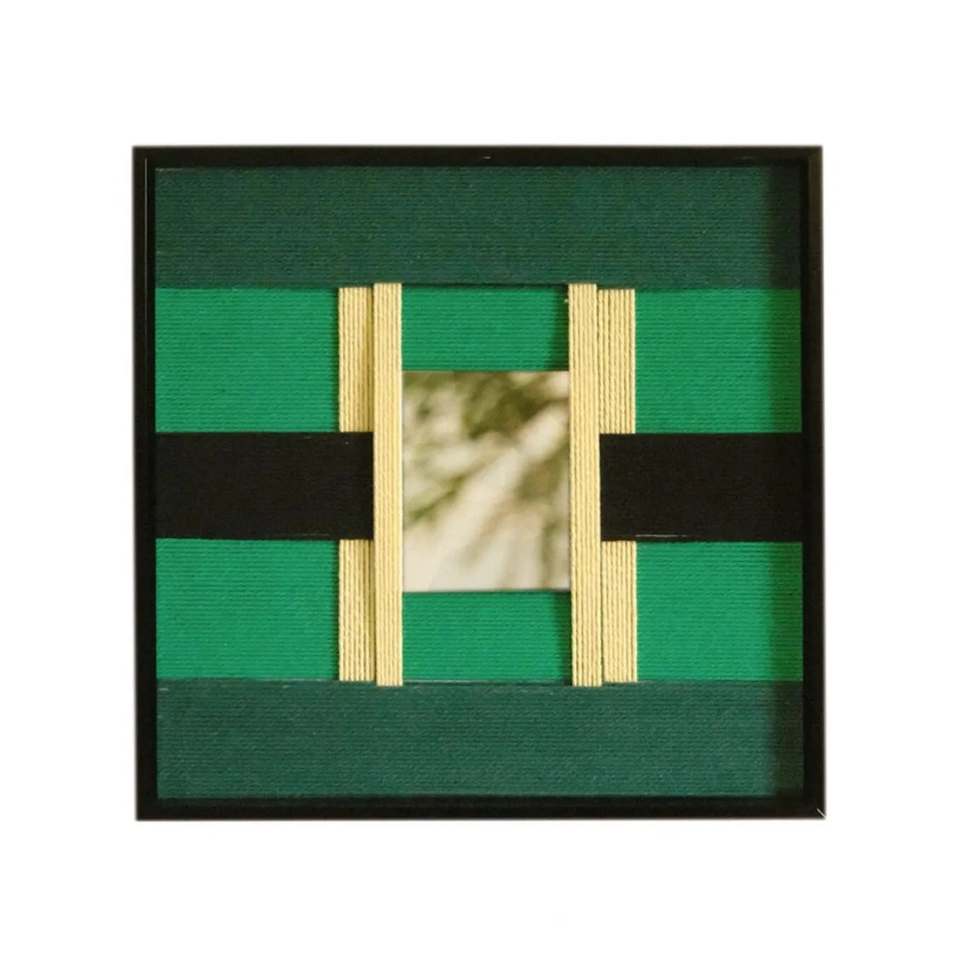 Front view of Green Glow yarn woven wall art on a plain white background, showing its exact square proportions and contrasting green stripe pattern