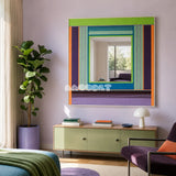 Hidden Forest colorful yarn-framed mirror displayed above a pale green sideboard in a sunlit modern bedroom.