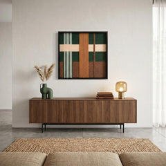 Large square Jade Manor fiber wall art featuring forest green and oak-toned hand-woven wool patterns hanging above a mid-century modern walnut sideboard.
