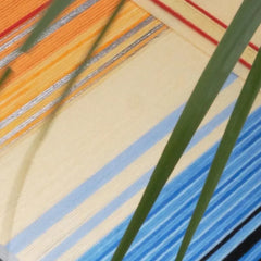 Angled view of Love at Sunset wall art highlighting wooden frame and woven texture.