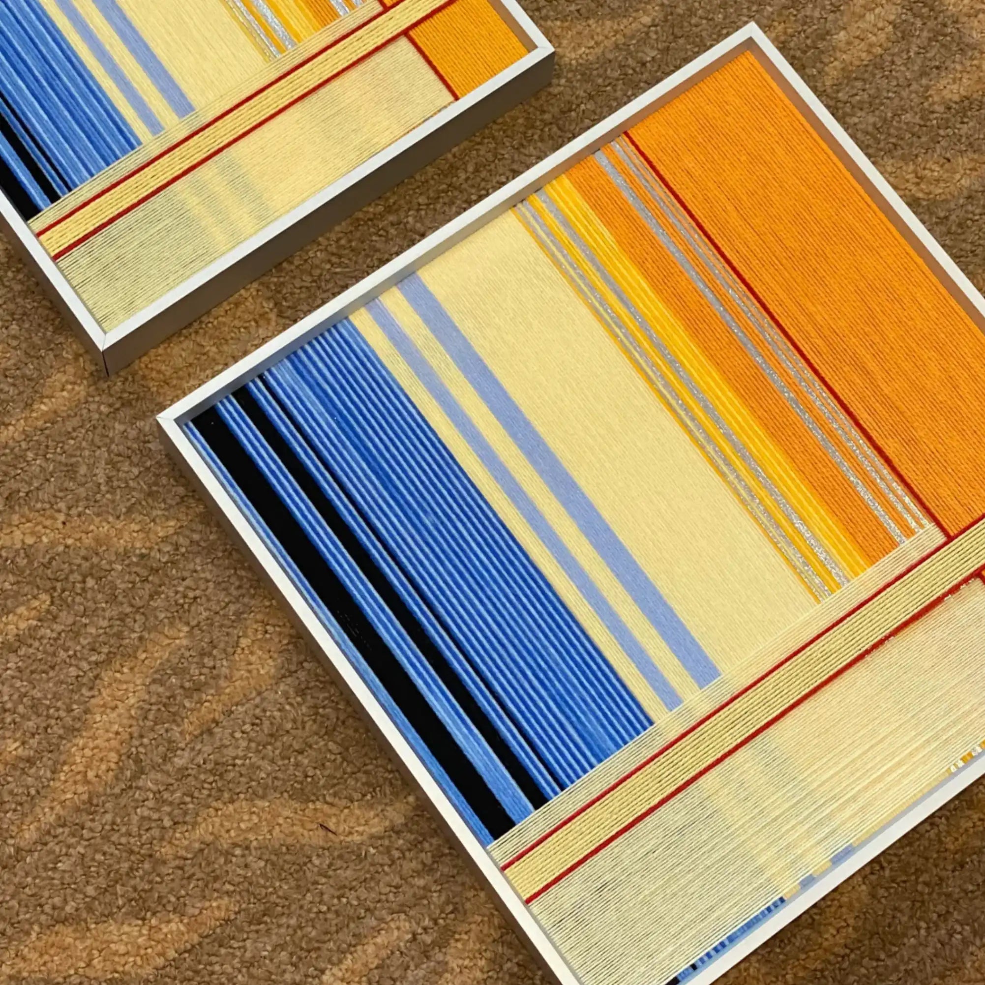 Overhead view of Love at Sunset square wall art displaying full gradient pattern from yellow to blue.