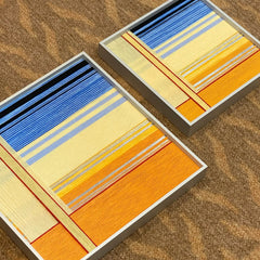 Love at Sunset wall art styled on a tabletop with modern decor accents.