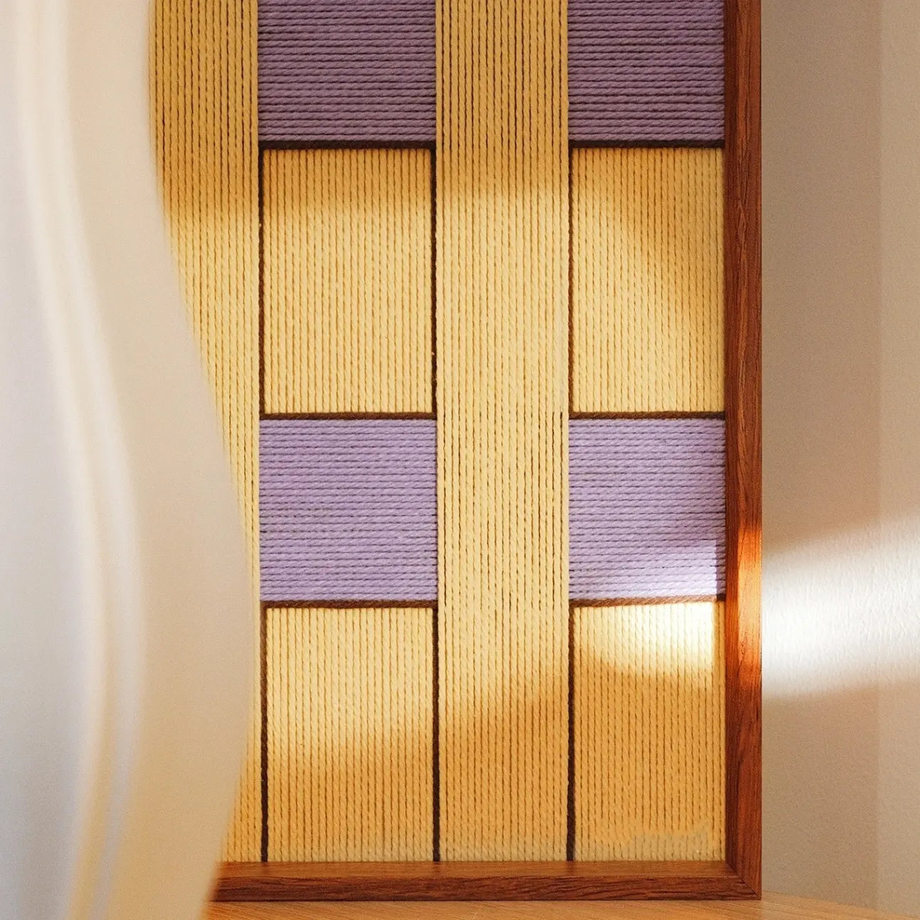 Front view of Lover’s Moonlight Violet square yarn art showing neat grid pattern of lavender and yellow stripes for a balanced geometric look