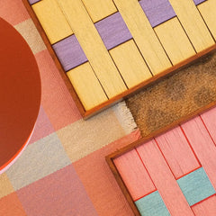 Macro shot of Lover’s Moonlight Violet wool yarn texture detailing looped stitching and vibrant stripe colors