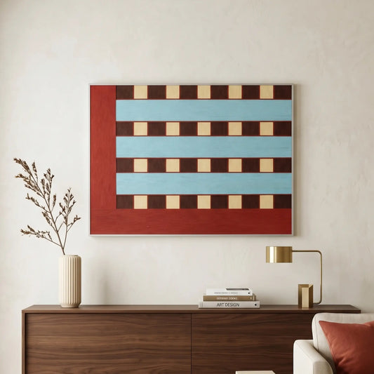 Horizontal hand-woven wool wall art featuring a bold red L-shaped border and a sky blue and brown checkerboard pattern hanging above a walnut sideboard.