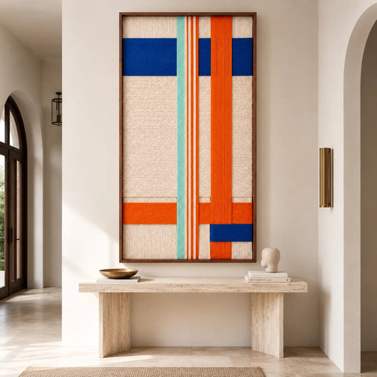 The Midtown Rhythm hand-woven wool tapestry displayed elegantly above a modern console table, enhancing the warm, quiet luxury aesthetic of the room.