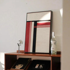 Macro detail of “Napoli” yarn wall art revealing tight stitch work and crisp transitions among red, black, and white yarn panels