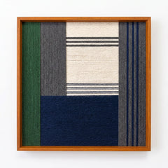 Professional studio shot of the Needle and Ink hand-woven wool wall art in an oak frame against a clean white background.