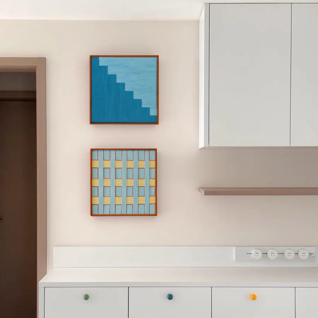 Detailed shot showing subtle gradient shifts from pale yellow to soft blue in adjacent yarn panels