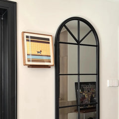 Pawsy Puppy wall art hung on a hallway wall beside an arched mirror, emphasizing its compact square form and playful puppy design.