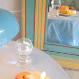 Pear Blossom Tree framed fiber mirror being positioned on a wall
