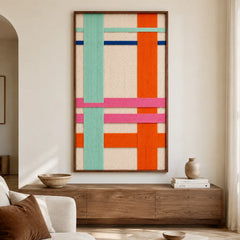 Contemporary living room decor featuring the framed textile art hanging gracefully on a neutral wall above a modern wooden media console cabinet.