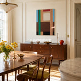 Wild RE001 abstract textile artwork with architectural color blocking displayed in a modern home setting.