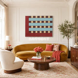 Malèna: A Sicilian Beauty RE013 framed textile art with burgundy red, light blue, cream, and dark brown yarn displayed in a Mediterranean interior.