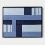 Front view of Nordic Tide RE028 blue geometric textile wall art in a black frame on a white background.