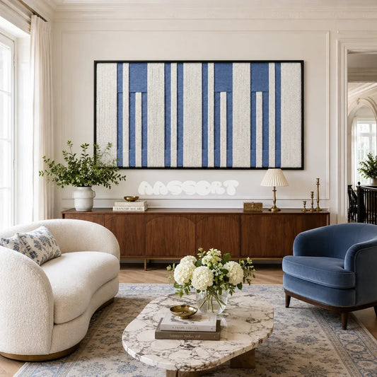Blue Cadence RE031 panoramic framed textile art with ivory and muted denim blue vertical yarn bands displayed in a modern interior.
