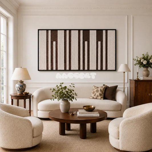 Cocoa Pillars RE035 panoramic framed textile art with warm ivory and cocoa brown vertical yarn bands displayed in a modern interior.