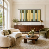 Garden Interval RE036 panoramic framed textile art with olive green, pale yellow, mint, and ivory vertical yarn bands displayed in a bright interior.