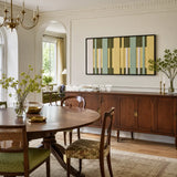Garden Interval RE036 framed fiber artwork featuring rhythmic olive, mint, yellow, and ivory vertical bands in a modern interior.