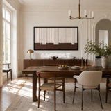 Framed Ivory Rhythm woven wall hanging with cream vertical lines and a brown base in a refined neutral room.