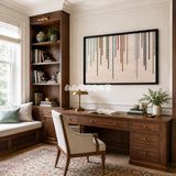 Framed Chromatic Rain woven wall hanging with colorful dripping yarn stripes in a refined room.