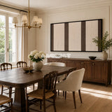 Framed Eternal Colonnade woven wall hanging with cream and brown geometric stripes in a refined neutral room.