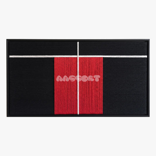 The Divide, framed textile wall art with a red vertical block and fine white cross on black.