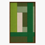 Front studio view of Evergreen Harmony framed fiber wall art with lime, forest green, sage, and cream geometric blocks on a white background.