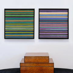 Reconstructing the Future hand-woven yarn art diptych with multicolor horizontal stripes on two square panels in natural wood frames, displayed above stacked wooden boxes.