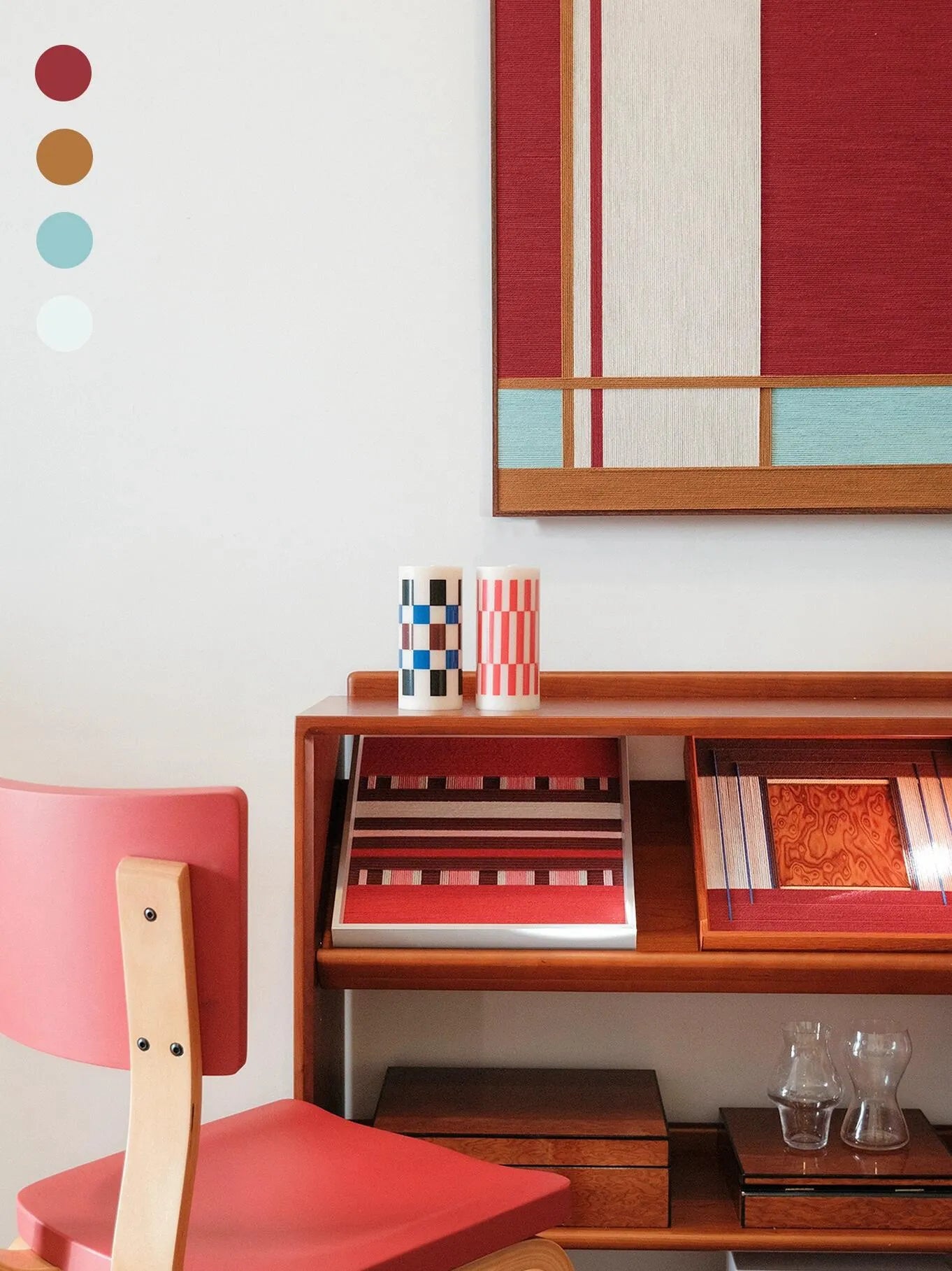 Close-up of Red House yarn wall art revealing tight looped wool stitches and crisp edge transitions between the red panel and turquoise stripes.