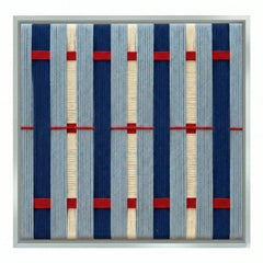 High-resolution front view of Seaside Cinema hand-woven wool tapestry showcasing the intricate vertical navy bars and red geometric accents.