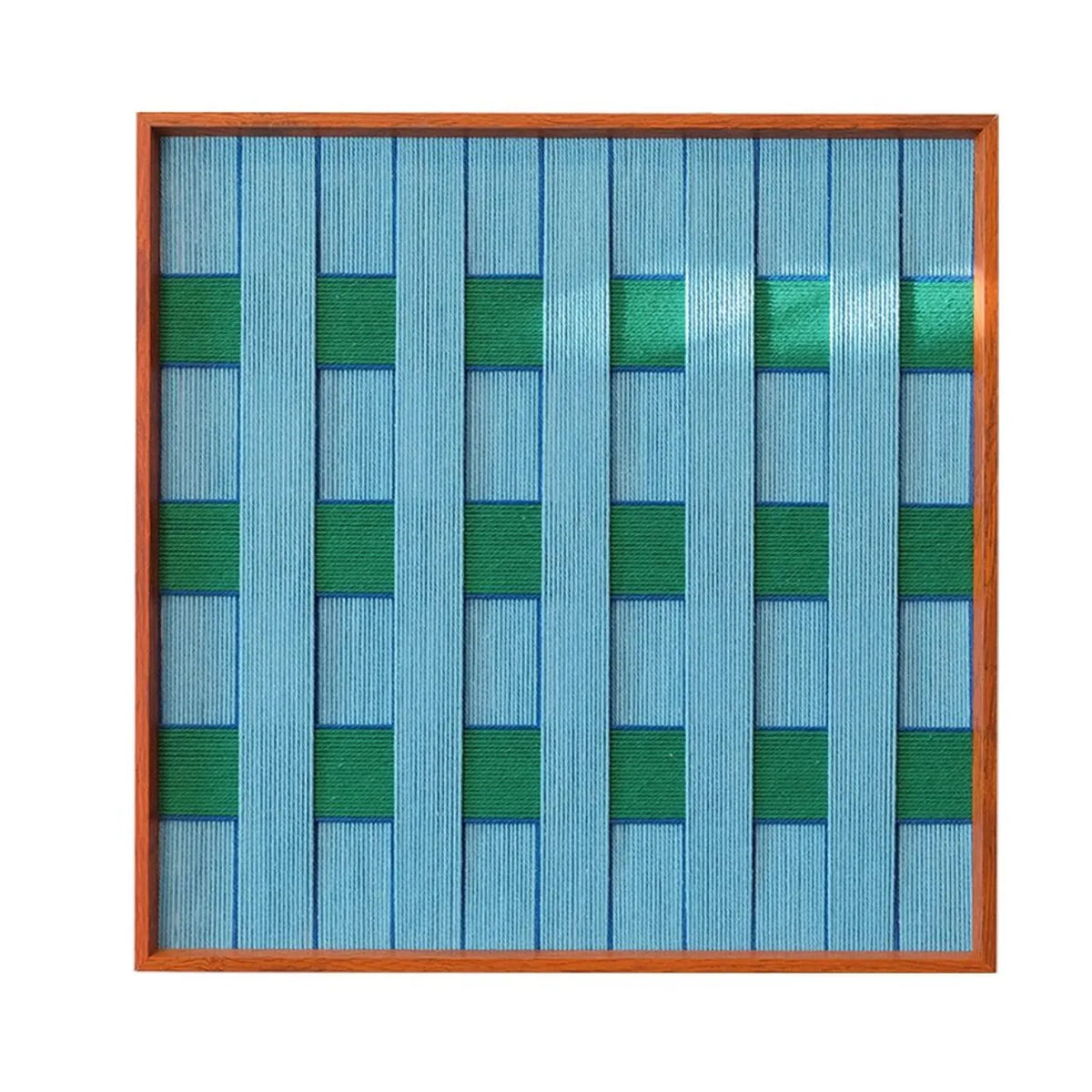 Hand-held view of Seine Riverbank yarn wall art showing its sturdy frame and easy-to-hang compact size