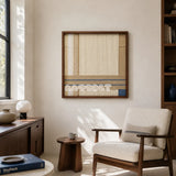 Shadow at 4 PM cream sand and slate blue textile wall art featured above a cream armchair in a sunlit modern reading corner.