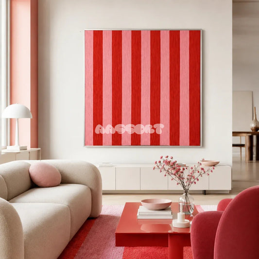Hana and Alice SQ003 red and pink striped hand-wrapped yarn wall art above a white console in a bright modern living room