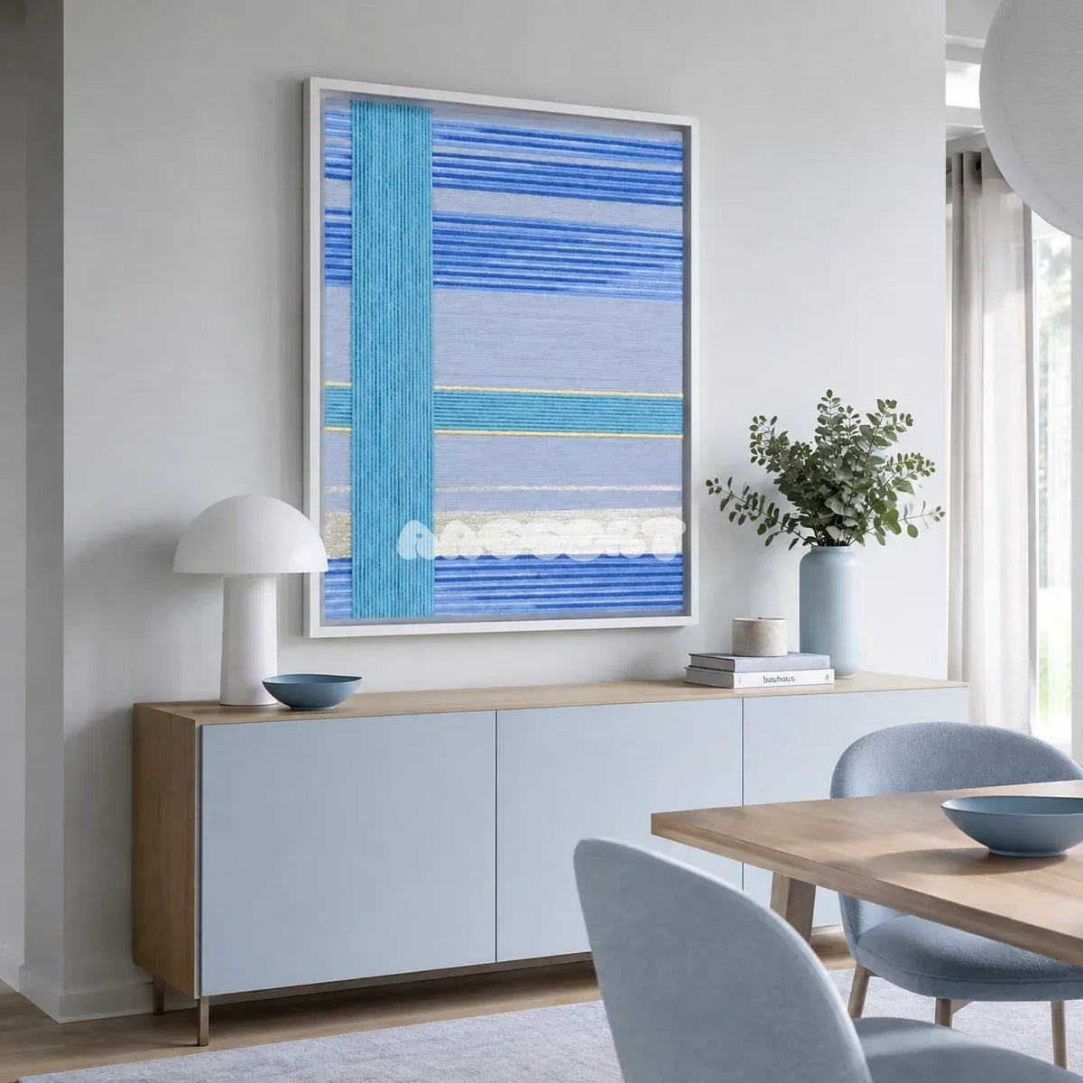 Blue Sea SQ008 blue cyan silver and yellow soft cotton cord wall art above a light blue sideboard in a bright modern dining room