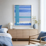 Blue Sea SQ008 blue cyan silver and yellow soft cotton cord wall art above a light wood sideboard in a serene modern bedroom