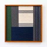 Front view of Needle and Ink SQ085 geometric yarn wall art in a sleek square frame on a white background.